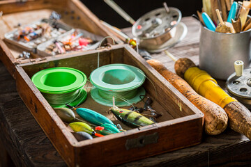 Old fishing tackle with flies and rods. Fishing equipment.