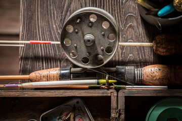 Vintage stuff for angler with rod and lures. Fishing equipment.
