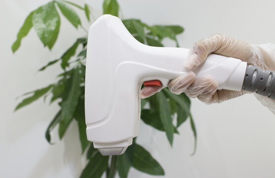 Hand holding a laser machine