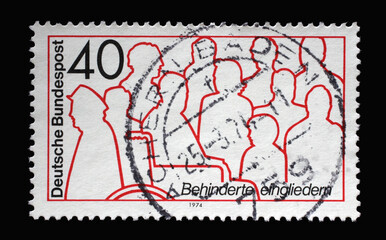 A stamp printed in Germany shows Reintegration handicapped people, circa 1974