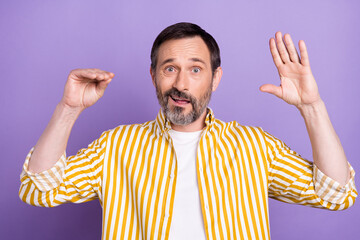 Fototapeta premium Photo of sweet excited mature man dressed striped shirt showing arms be quiet isolated violet color background