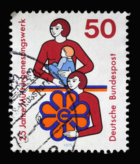 A stamp printed in Germany showing a mother and child as well as woman, 25th Anniv. of Organisation for the Rest and Recuperation of Mothers, Convalescent Mothers’ Foundation, circa 1975