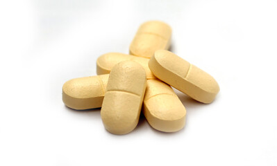 mall medicine tablets (or pills) over white background