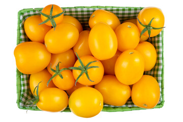 Yellow tomatoes in a basket isolated on white background. Diet food. Fresh and healthy vegetables. Top view.