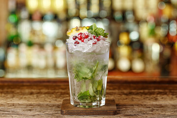 Cocktail with brandy, mint and peach puree