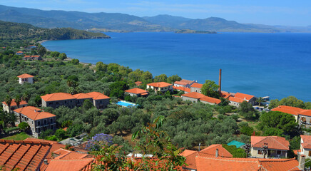 Naklejka na ściany i meble Molyvos, Lesvos, Greece Hotels, Restaurants and Beach with mountains in the background.