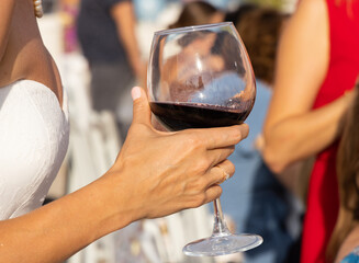 a woman drinking red wine
