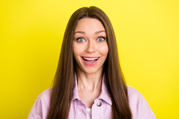 Fototapeta premium Portrait of attractive cheerful amazed girl good news reaction having fun isolated over bright yellow color background