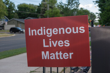 Sign indigenous lives matter at the memorial at catholic church  in tribute to 215 indigenous...