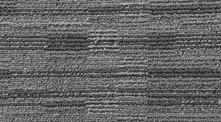 close up of grey monochrome carpet texture background for interior flooring material. office carpet background. interior floor covering material background. 