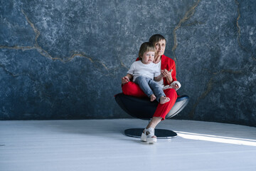 Portrait of great-grandmother and grandson in the room