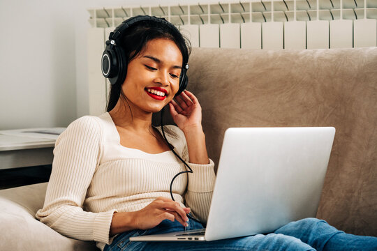 Dreamy Woman With Laptop And Headphones