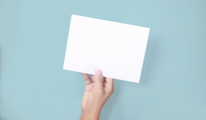 Fototapeta premium Hands holding paper blank for letter paper