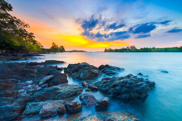 Amazing sunset in Dangas  beach, Batam island, stone on beach