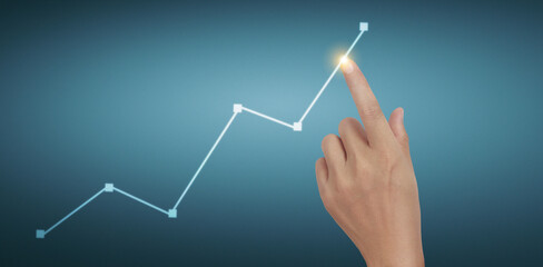 Hand touching graphs of financial indicator and accounting market  chart