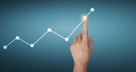 Hand touching graphs of financial indicator and accounting market  chart