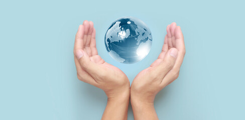 Glass globe in hand,Energy saving concept, by NASA
