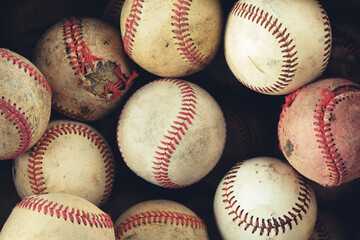 Vintage baseballs as group of balls for background of used sports equipment in game.