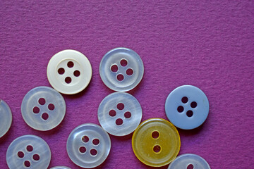 White round buttons on a purple background