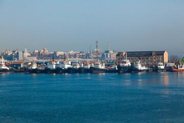 There are many tugs at the pier in the port of Constanta Romania.
