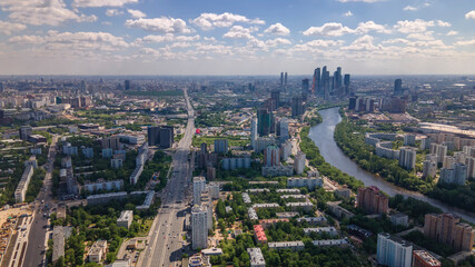 Beautiful city landscape from above. Tall houses and green parks. Sunny day. Beautiful city.