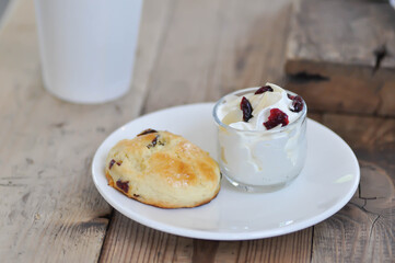 scone , cranberry scone or scone with whipped cream and drink
