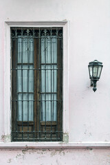 Ols window and old lamp in the streets of Buenos Aires, Argentina
