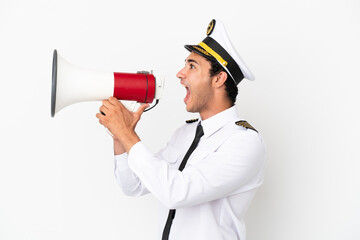 Airplane pilot over isolated white background shouting through a megaphone