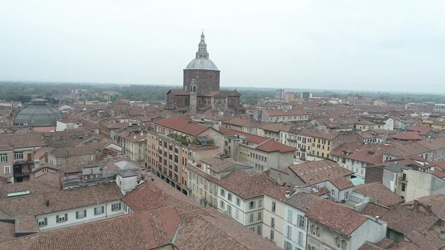 Aerial footage drone view of monuments and skyline of Pavia, beautiful old city town in Italy // no video editing
