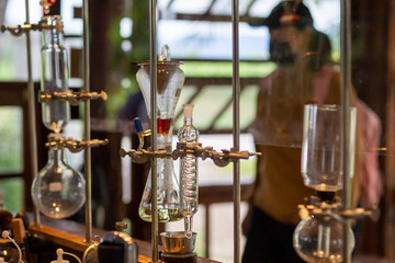 Fototapeta na wymiar selective focus glass ampoules distillation experiment in the lab of coffee shop drink For the best coffee and beverages in Thailand