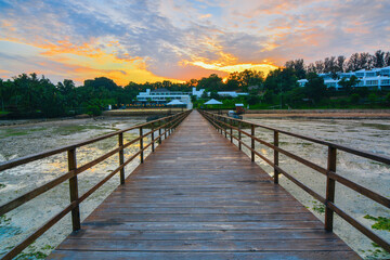 Fototapeta na wymiar Beautiful Sunrise on sea with pier for foreground in batam island