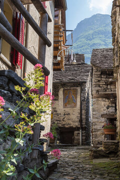 Traditional stone houses and narrow lanes in the half deserted village Corippo in Canton Ticino, Swizterland - most of the houses are empty and dilapidated