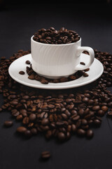 Cup of coffee isolated on coffee background