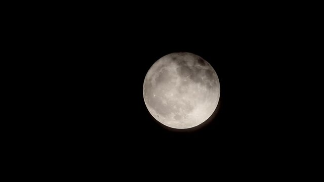 full moon rising in the sky