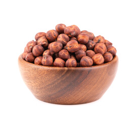 Pile of brown chickpeas in wooden bowl, isolated on white background. Brown chickpea. Garbanzo, bengal gram or chick pea bean.