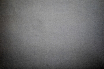 Obraz premium Sandpaper texture background gives a beautiful pattern of black sand grains on sandpaper, suitable as a background for inserting text. Copy Space for designers to use on sandpaper.