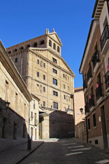 Fototapeta na wymiar Walking by the street towards the facade of the Pontifical University of Salamanca.