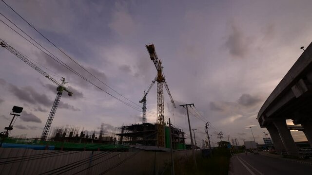 Moving construction Tower Cranes in time lapse