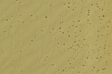 The shadow of the raindrops that remained on the window created a textured pattern.