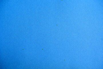 Blue background. Cardboard texture with sparkles.