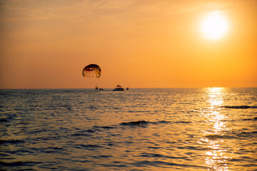 beautiful landscape with sea views and parachute boats. Sunset at the sea. Beautiful seascape.