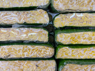Indonesian traditional food, called "Tempe". Stack on the supermarket display rack.