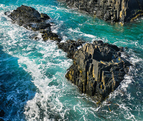 Pembrokeshire Coast Path rocks in ocean uk.
