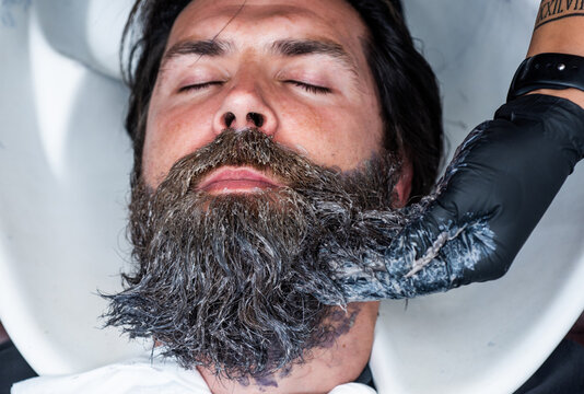 barbershop washbasin. male trendy hairdo. perfect haircut. barber master cut hair. mature hipster with beard at hairdresser. hipster with moustache wash hair before new hairstyle. beard grooming