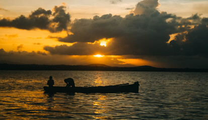 Fototapeta na wymiar silhouette, beautiful panorama of fishermen in sunset hours
