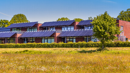 Public school building with solar panels as sun protection - Powered by Adobe