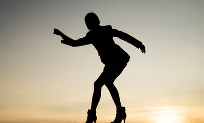 Fototapeta na wymiar Express yourself. Woman silhouette on evening sky. Woman ballet dancer. Dancing silhouette