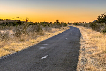 Sunrise over road in Causse Blandas