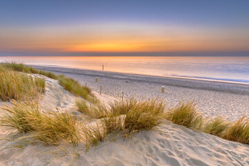 Fototapeta na wymiar Sunset View over ocean from dune in Zeeland