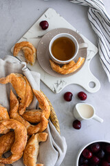 breakfast tea with pastries on white background